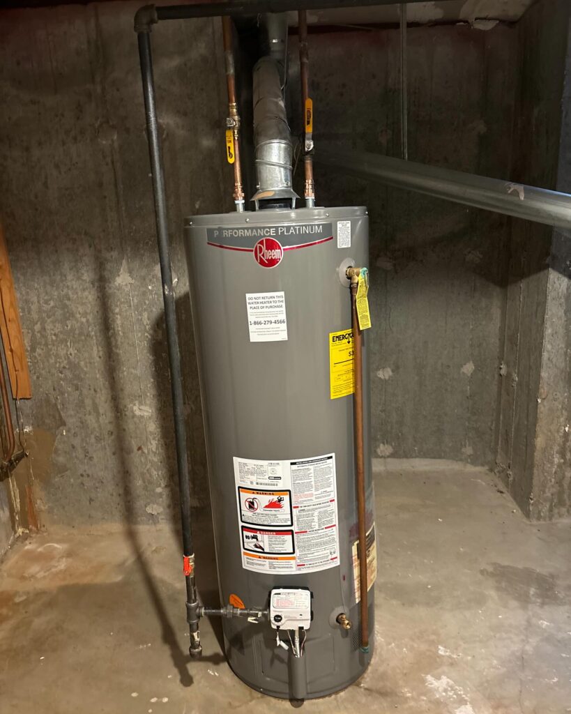 Technician installing tankless water heater in Long Island home