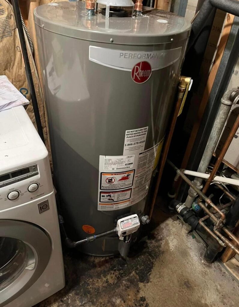 Plumber installing new water heater water supply line