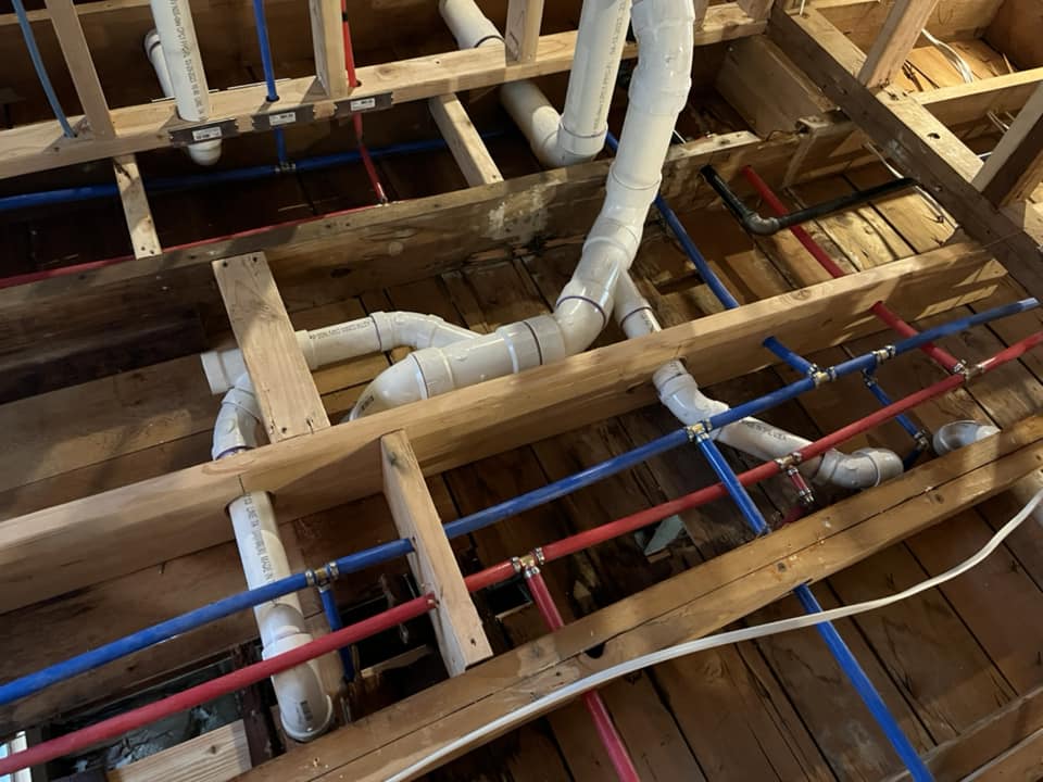 PVC drain pipe system installed inside kitchen wall structure