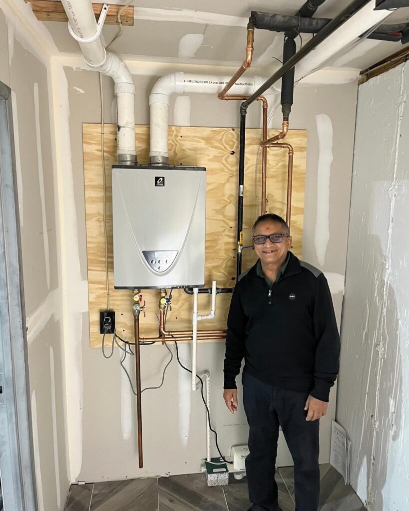 Heating technician testing thermostat settings during maintenance visit