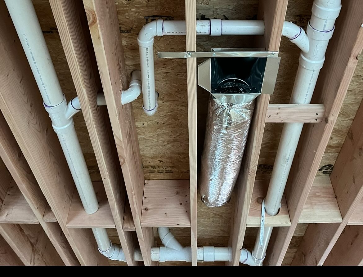 HVAC technician installing new duct boot connection in floor register