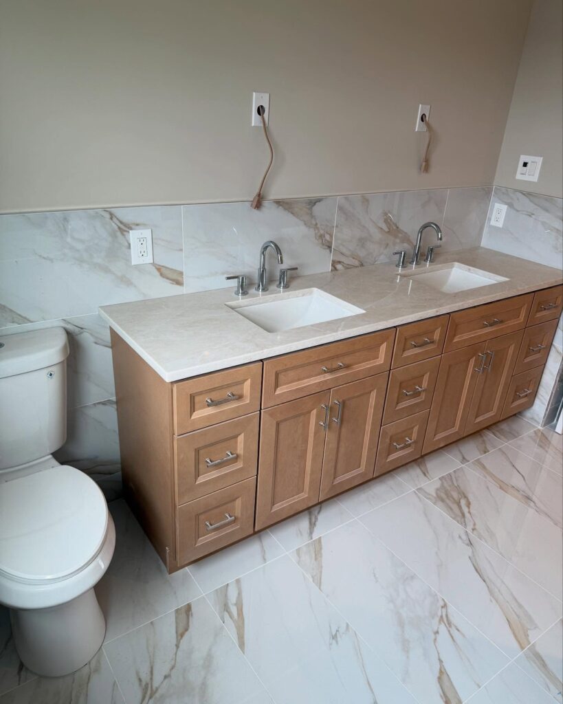 Bathroom vanity sink fixture connected to plumbing lines