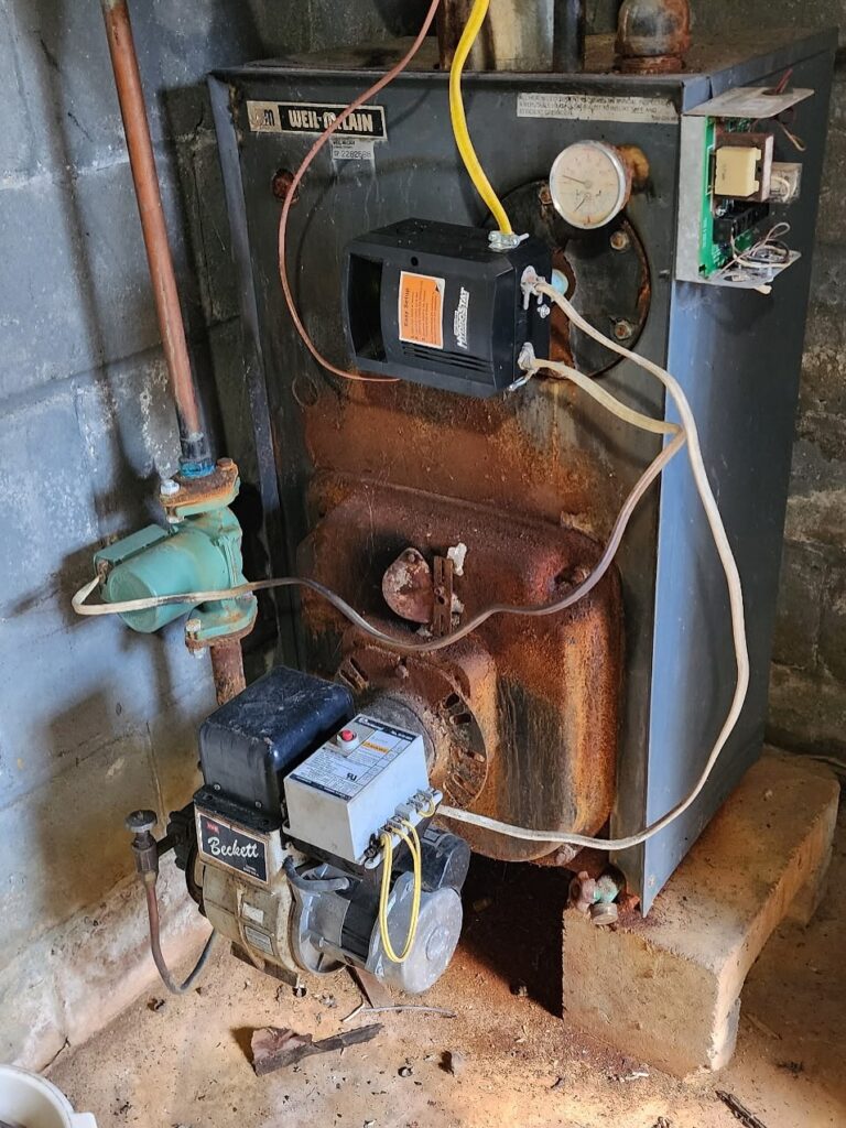 HVAC technician repairing blower motor in residential furnace