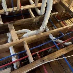 PVC drain pipe system installed inside kitchen wall structure