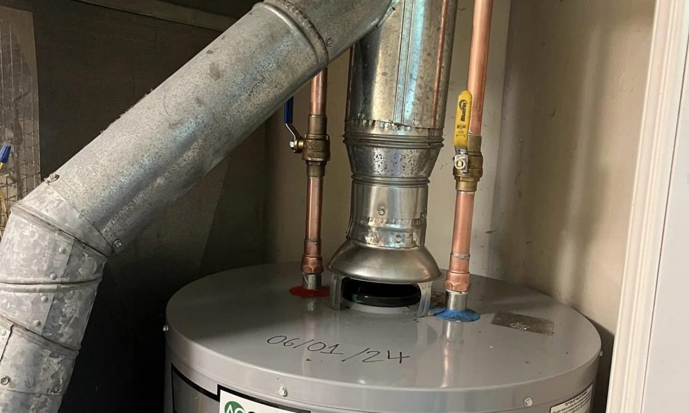 Heating technician installing new boiler circulation pump