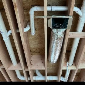 HVAC technician installing new duct boot connection in floor register