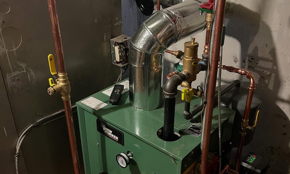 HVAC technician replacing worn blower motor in furnace